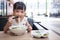 Asian little Chinese girl eating beef noodles soup