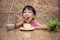 Asian little Chinese girl eating delicious cake