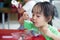 Asian little Chinese girl eating glutinous rice