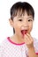 Asian Little Chinese Girl Eating Strawberry