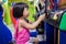 Asian Little Chinese Girl Playing Arcade Game Machine