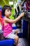 Asian Little Chinese Girl Playing Arcade Game Machine