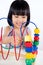 Asian Little Chinese Girl Playing Colorful Educational Toy