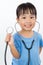 Asian Little Chinese Girl Playing Doctor with a Stethoscope