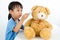 Asian Little Chinese Girl Playing Doctor with Teddy Bear