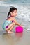 Asian Little Chinese Girl Playing Sand with Beach Toys