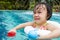 Asian Little Chinese Girl Playing in Swimming Pool