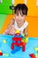 Asian Little Chinese Girl Playing Wooden Blocks