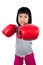 Asian Little Chinese Girl Wearing Boxing Glove With Fierce Expre