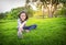 Asian little girl exercising at the outdoor park on the lawn is a meditation practice,child exercise in nature in the morning,