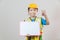 Asian Little Girl or Kids in Blue shirt and Yellow Hardhat standing and holding whiteboard in hand