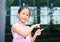 Asian little girl posture pointing her forefinger beside with cute smile