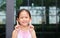 Asian little girl posture pointing her forefinger up with little smile