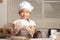 An Asian little girl showing make the dough for a homemade bakery