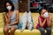 Asian Little Girls Get Bored Sitting on Sofa Apart from Each Other