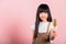 Asian little kid 10 years old hold comb brushing her unruly she touching her long black hair