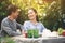 Asian lovely couple retirement having a happiness talking during dinner in backyard. Happy family after retirement