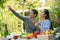 Asian lovely couple retirement having a happiness talking during dinner in backyard. Happy family after retirement