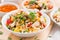 Asian lunch - fried rice with tofu, noodles with vegetables