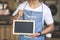 Asian male cafe owner with blank board