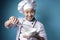 Asian Male Chef Mixing Ingredient in Bowl with Whisk