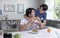 Asian male couple lifestyle living concept. Happy LGBT gay couple having breakfast together in the kitchen