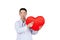 Asian male doctor auscultation a red heart with a stethoscope,