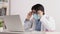 Asian Male Doctor Wear Mask and Glasses Working with Video Conference Laptop