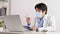 Asian Male Doctor Wear Mask Video Conference with Patient