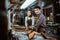 Asian male and female leather worker smiling in his studio