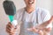 Asian male inspector smile to cleaning staff in bathroom disinfectant sprayers and germs  Metaphor for cleaning Get rid of germs