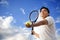 Asian male playing tennis