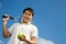 Asian male playing tennis