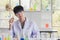 Asian male scientist stand and smile in lab room