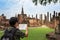Asian male traveler is viewing the map of Sukhothai Historical Park