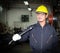 Asian male worker In industries that wear glasses, safety hats and safety uniforms Wrench tool holder stand