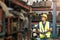 Asian male worker working to checking products stock inventory at warehouse shelf