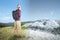 Asian man with backpack looking at the landscapes with winter and summer climate