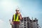 Asian man civil engineer wearing safety helmet in site work.