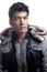 Asian man in fur and yarn texture jacket