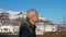 Asian man happy portrait with Europe snow mountain village background