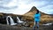 Asian man at iconic mountain Kirkjufell of Iceland. Once in a li