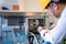 Asian man Mechanic technician worker working install and checking the electric control cabinet of conveyer in industrial factory