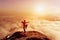 Asian man meditates in yoga position. Above clouds