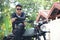 Asian man motorbike in black leather jacket travel rider trip. Handsome Men wear sunglass outdoor lifestyle freedom rider. Men