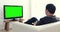 Asian man Play Computer Game Using with green screen on television.