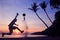 Asian man play soccer on the beach at sunrise early morning