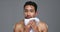 Asian man, shower and towel for grooming, hygiene or drying body against a grey studio background. Portrait of male