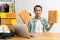 Asian man start up small business owner holding packing cardboard box