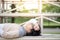 Asian man student lying on cheer stand